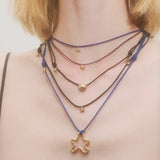 GOLD RICCIO NECKLACE